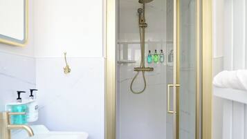 Economy Double Room | Bathroom | Shower, hair dryer, slippers, towels