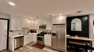 Fridge, coffee/tea maker, cookware/dishes/utensils