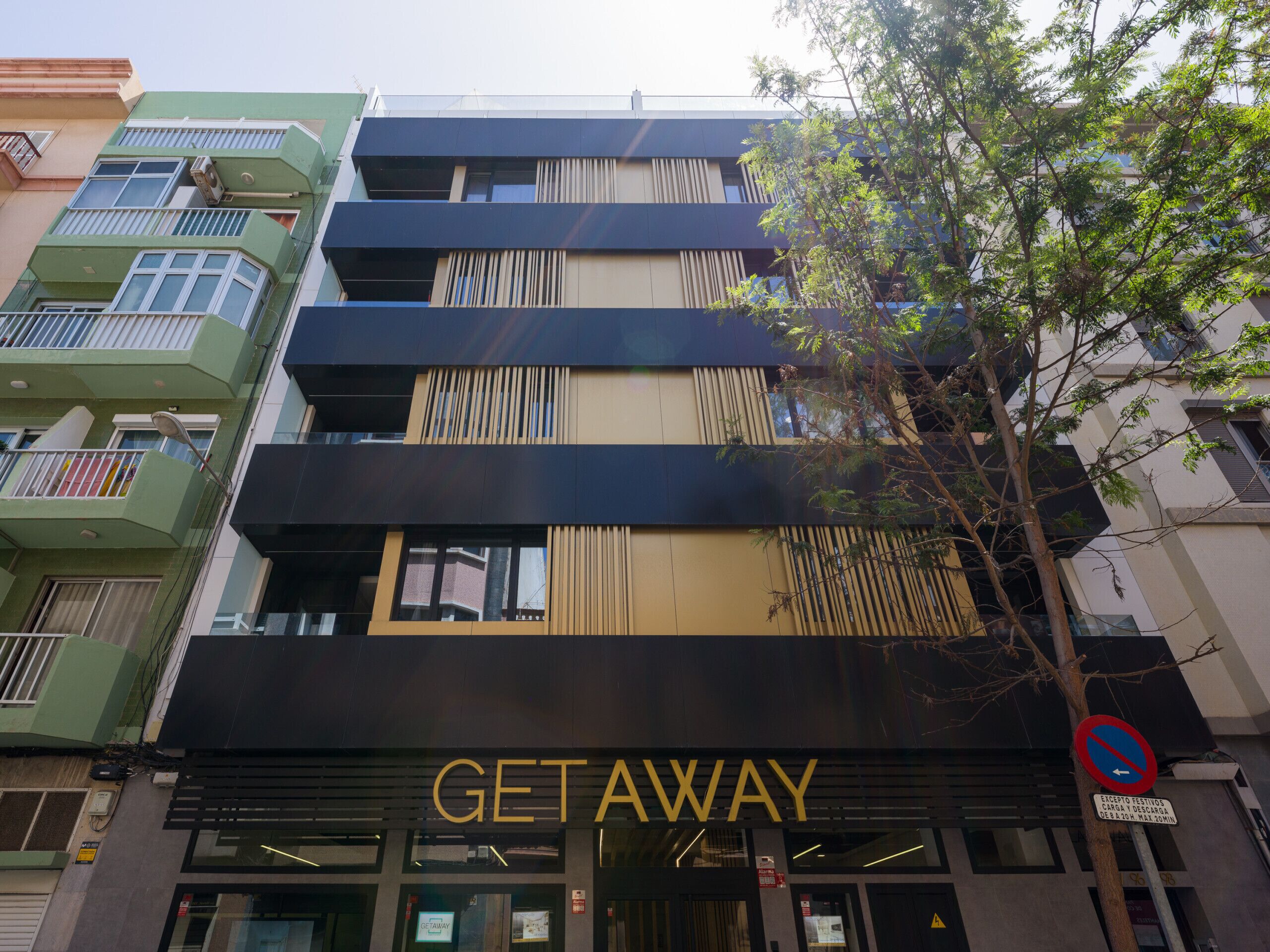 A multi-story building with a prominent "GETAWAY" sign at the ground level.