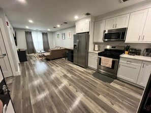 Fridge, coffee/tea maker, cookware/dishes/utensils - The Homey Suite: 1BR with Luxe Amenities (Paterson)