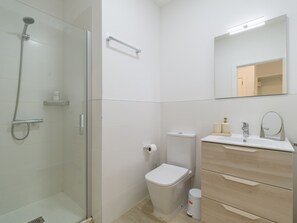 Shower, hair dryer, towels, toilet paper
