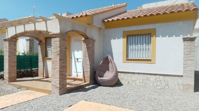 Detached Villa with Communal Pool Close to beaches and Golf Course.