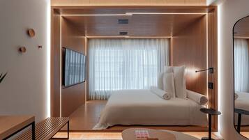 Kamar Double Deluks | Seprai premium, minibar gratis, brankas, dan tirai kedap cahaya