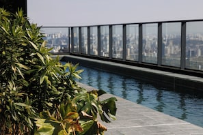 Outdoor pool, pool umbrellas, sun loungers