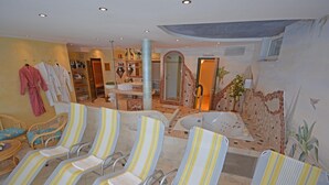 A spa area with multiple chairs, a bathtub, and a shower area. - Apartment in Pitztal With Mountain Views (Arzl im Piztal)