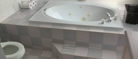 Shower, jetted tub, towels, soap