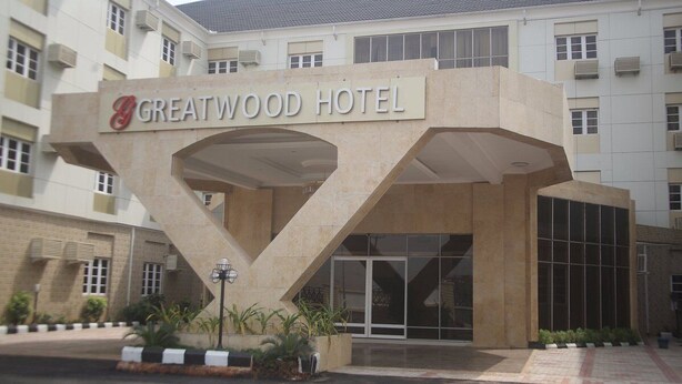 The Greatwood Hotel entrance with a distinctive geometric design and large windows. - Greatwood Hotel (Owerri)