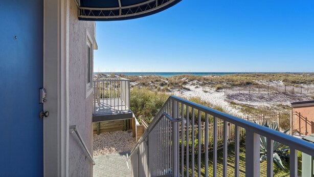 A balcony with a view of the beach and ocean. - Starboard Village 612 | Beachfront | Pensacola Beach | Pool | My Beach Getaways (Pensacola Beach)