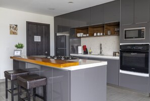 Fridge, coffee/tea maker, cookware/dishes/utensils