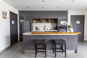 Fridge, coffee/tea maker, cookware/dishes/utensils