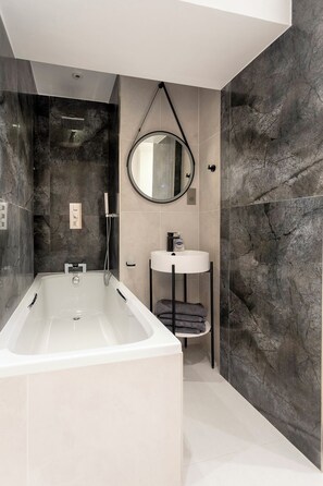 Shower, hair dryer, towels, toilet paper
