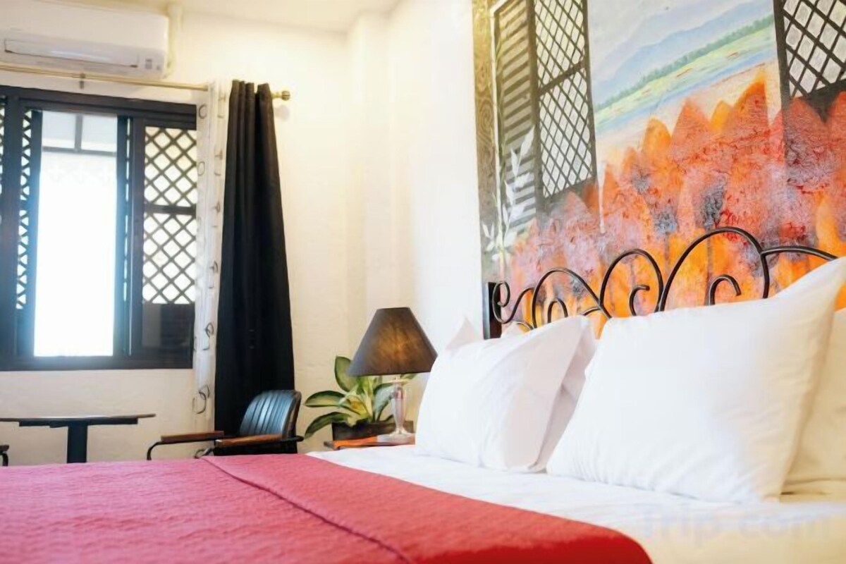 Desk, blackout drapes, rollaway beds (surcharge), WiFi (free)