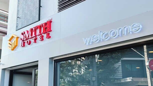 The exterior of the Smith Hotel with a 'Welcome' sign. - Smith Hotel (Chiang Mai)