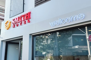 The exterior of the Smith Hotel with a 'Welcome' sign. - Smith Hotel (Chiang Mai)