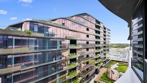 A modern multi-story building with balconies, large windows, and a view of the surrounding area. - The Atrium - Resort-Style Glen Waverley Stay with Parking (Glen Waverley)