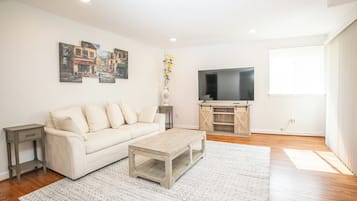 Comfort Apartment, Balcony | Living area | 55-inch LED TV with digital channels, streaming services