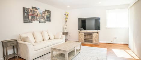 Comfort Apartment, Balcony | Living area | 55-inch LED TV with digital channels, streaming services