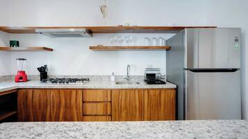 Fridge, microwave, stovetop, coffee/tea maker