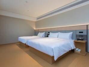 Family Triple Room, Garden View | Hypo-allergenic bedding, down comforters, minibar, desk