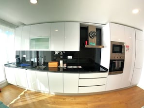 Coffee/tea maker, fridge, microwave, oven