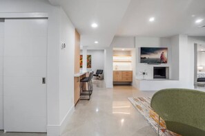 A modern interior with a kitchen, dining area, and living space.
