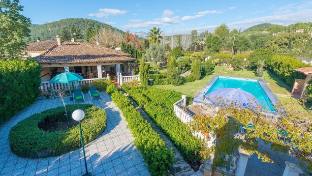 A villa with a tiled patio, a swimming pool, and a garden with neatly trimmed hedges. - Hibiscus - Villa With Private Pool In Crestatx (Crestatx , Illes Balears)