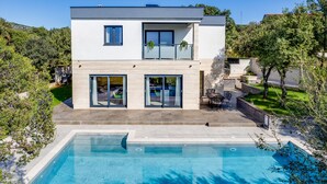 A modern two-story house with a swimming pool, a patio, and a garden. - Vacation home Golem by Interhome (Pakoštane)