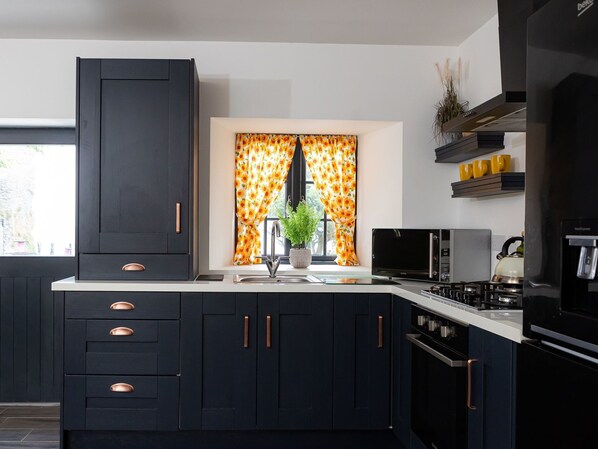 Fridge, microwave, cookware/dishes/utensils