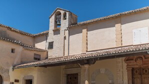 A building with a bell tower, arched doorways, and a tiled roof. - Finca Can Calisto - Apartment With Private Pool (Inca, Illes Balears)