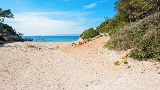 A sandy beach with a clear sky and distant sea. - Can Ferro - Villa With Private Pool In Cala Blava (Cala Blava (llucmajor), Illes Balears)
