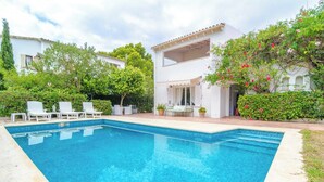 A rectangular swimming pool with white lounge chairs and a small table. - Can Ferro - Villa With Private Pool In Cala Blava (Cala Blava (llucmajor), Illes Balears)