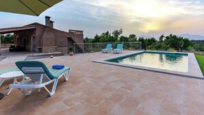 A rooftop pool area with lounge chairs and a covered patio. - Son Morro - Villa With Private Pool. Free Wifi (Santa Margalida, Illes Balears)
