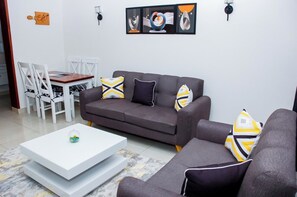 Apartment, Balcony, City View | Living area | 24-inch Smart TV with digital channels - Amalia Apartments Syokimau (Syokimau)