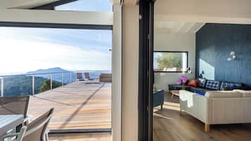 Comfort Villa, Sea View | Living area | Flat-screen TV