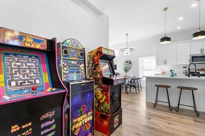 Game room - Spacious 4BR Home - Pool Getaway with Arcade Fun! (North Las Vegas)