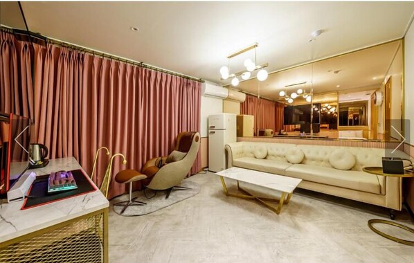 D - Luxury Suite, 2 Queen Beds, Balcony, City View | Living area | 65-inch LED TV with cable channels, Netflix, computer