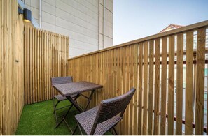 Luxury Suite, 2 Queen Beds, Balcony, City View | Terrace/patio