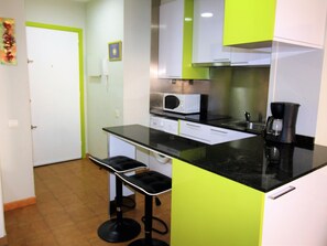 Fridge, microwave, stovetop, coffee/tea maker