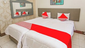 A neatly made bed with a red and white bedspread, a headboard, and a mirror above it. - Collection O Puncak Bogor Near Taman Safari Indonesia Formerly Hotel Andalus (Megamendung)