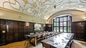 A conference room with a long table, chairs, and a large window. - Mansion by the Sea, 12BR/12BA, Perfect for Events (Bournemouth)
