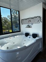 Deluxe Room, Lake View | Private spa tub
