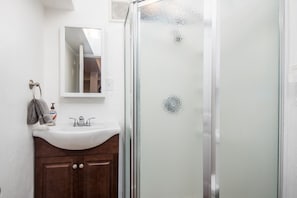 Shower, hair dryer, towels, soap