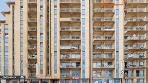 A multi-story hotel with balconies, a visible restaurant named "PIZZIANI," and a sign for "Saltwaters." - One-bedroom Flat With sea Views and Parking (Blankenberge)