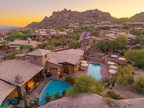 A resort with multiple buildings, a central swimming pool, and a mountainous backdrop. - The Rocks Residence Club | Private Plunge Pool, Troon Golf, Clubhouse (Scottsdale)