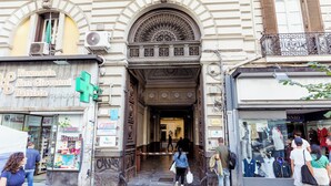 A building facade with a pharmacy, a boutique, and a visible entrance. - Umberto I Residence (Napoli)