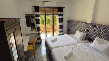 Desk, laptop workspace, free WiFi, bed sheets