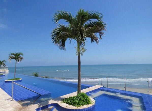 2 outdoor pools, open 10:00 AM to 7:00 PM, pool loungers