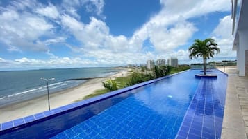 2 outdoor pools, open 10:00 AM to 7:00 PM, pool loungers