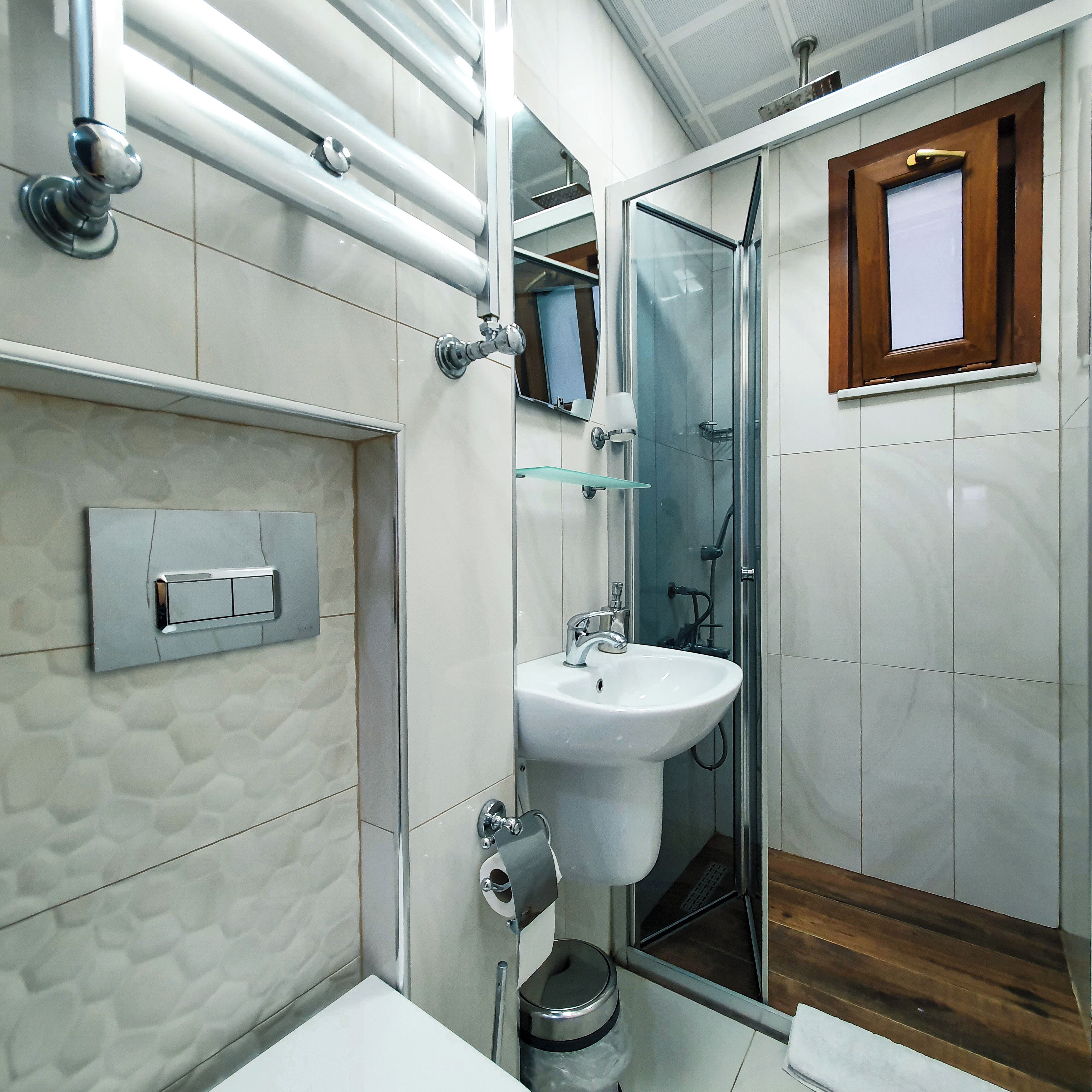 Shower, hair dryer, slippers, towels