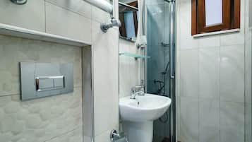 Shower, hair dryer, slippers, towels